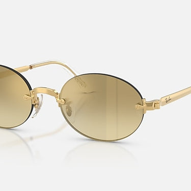 Ray-Ban RB3929 by A$AP Rocky 001/7I arista goud, glazen in bruin met kleurverloop en spiegelafwerking – schuin vooraanzicht