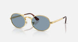 Ray-Ban RB3931 by A$AP Rocky 001/56 arista goud, glazen in blauw – schuin vooraanzicht